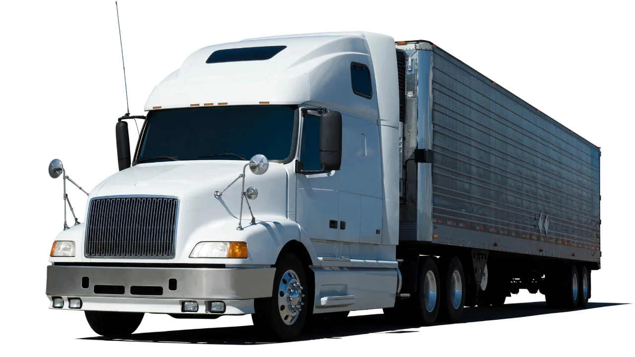 White semi-truck with a 53 ft dry van trailer